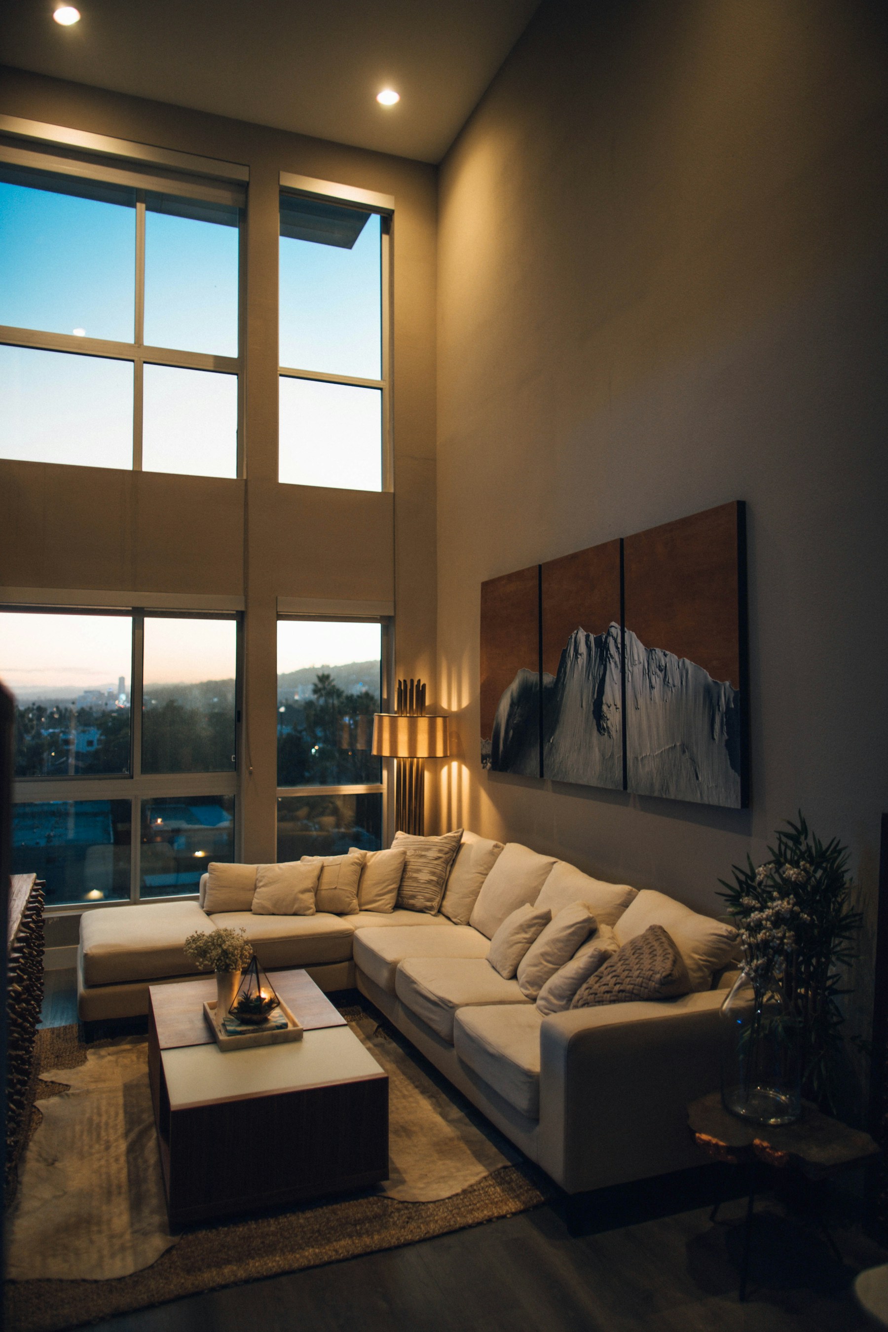 Double-height remodeled living room at dusk